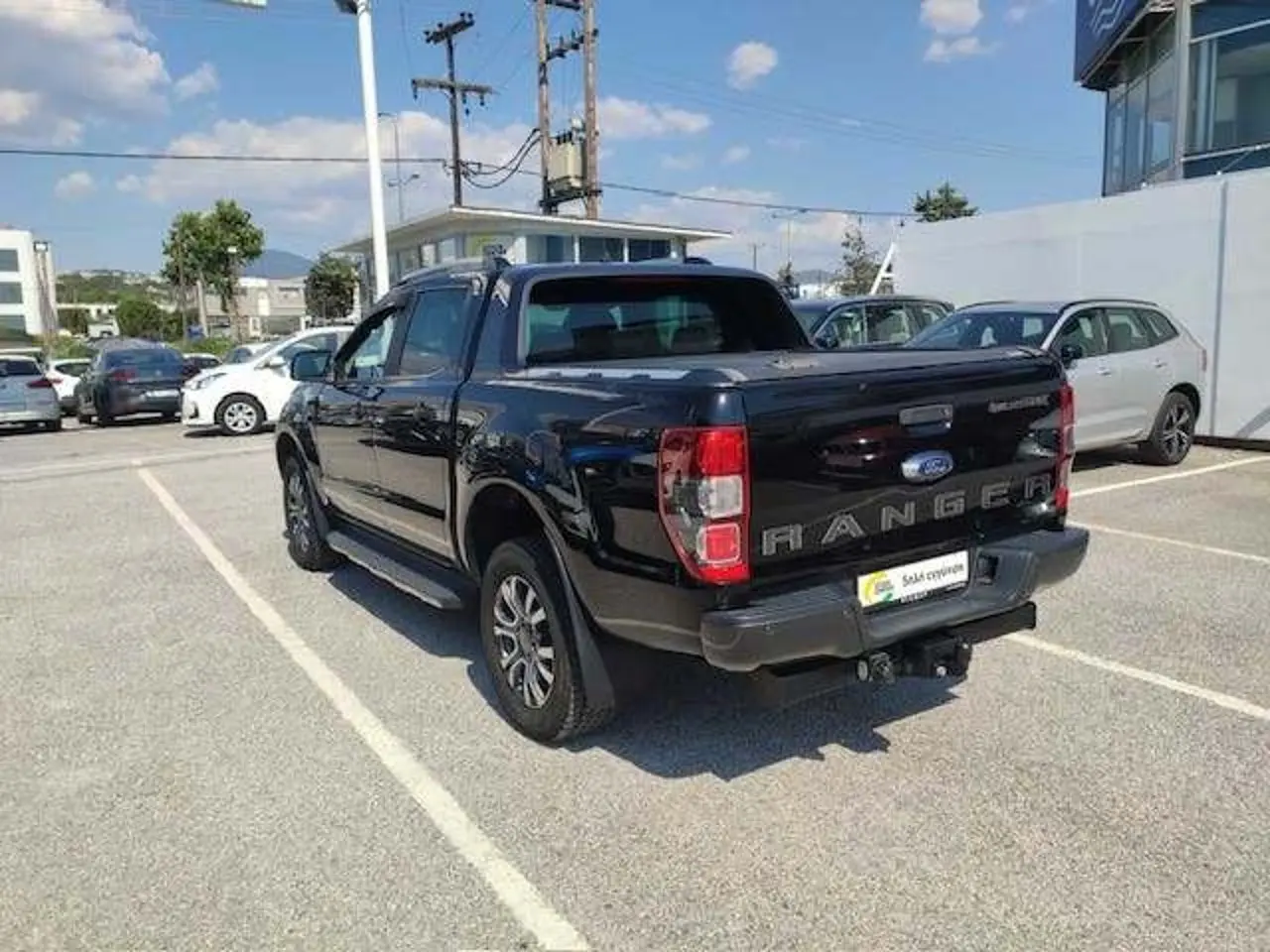 https://cdn.autoq.gr/websites/stock-center.gr/images/vehicles/ford-ranger-1-hrono-eggyisi-wild-track-mayro-2020/4_8.jpg