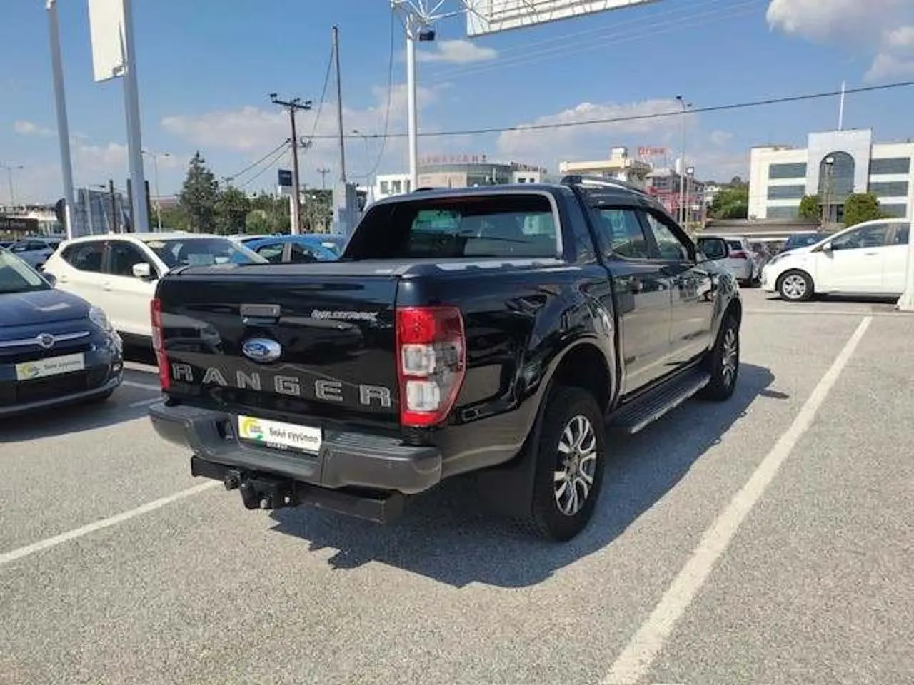 https://cdn.autoq.gr/websites/stock-center.gr/images/vehicles/ford-ranger-1-hrono-eggyisi-wild-track-mayro-2020/6_8.jpg