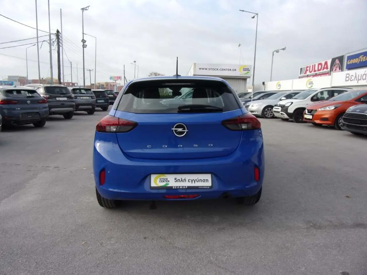https://cdn.autoq.gr/websites/stock-center.gr/images/vehicles/opel-corsa-5-hronia-eggyisi-corsa-edition-12lt-75hp-ss-mt5-mple-2024/opel-corsa-blue-5.jpg