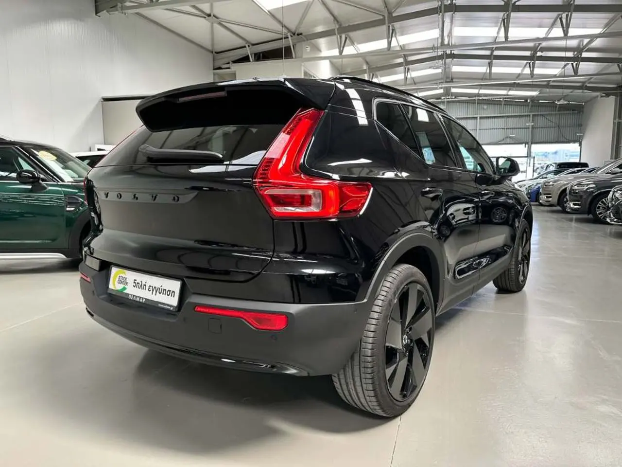 https://cdn.autoq.gr/websites/stock-center.gr/images/vehicles/volvo-xc40-5-hronia-eggyisi-eh40-plus-dark-edition-awd-mayro-2024/img_5309.jpg